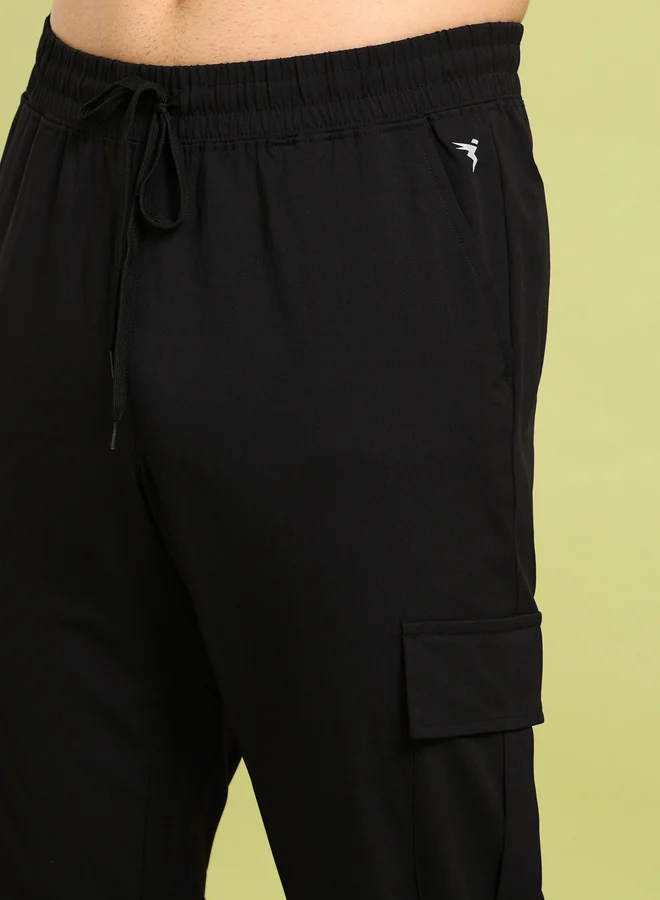 تكنوسبورت بنطلون كارجو مطاطي ثنائي الاتجاه بلون سادة