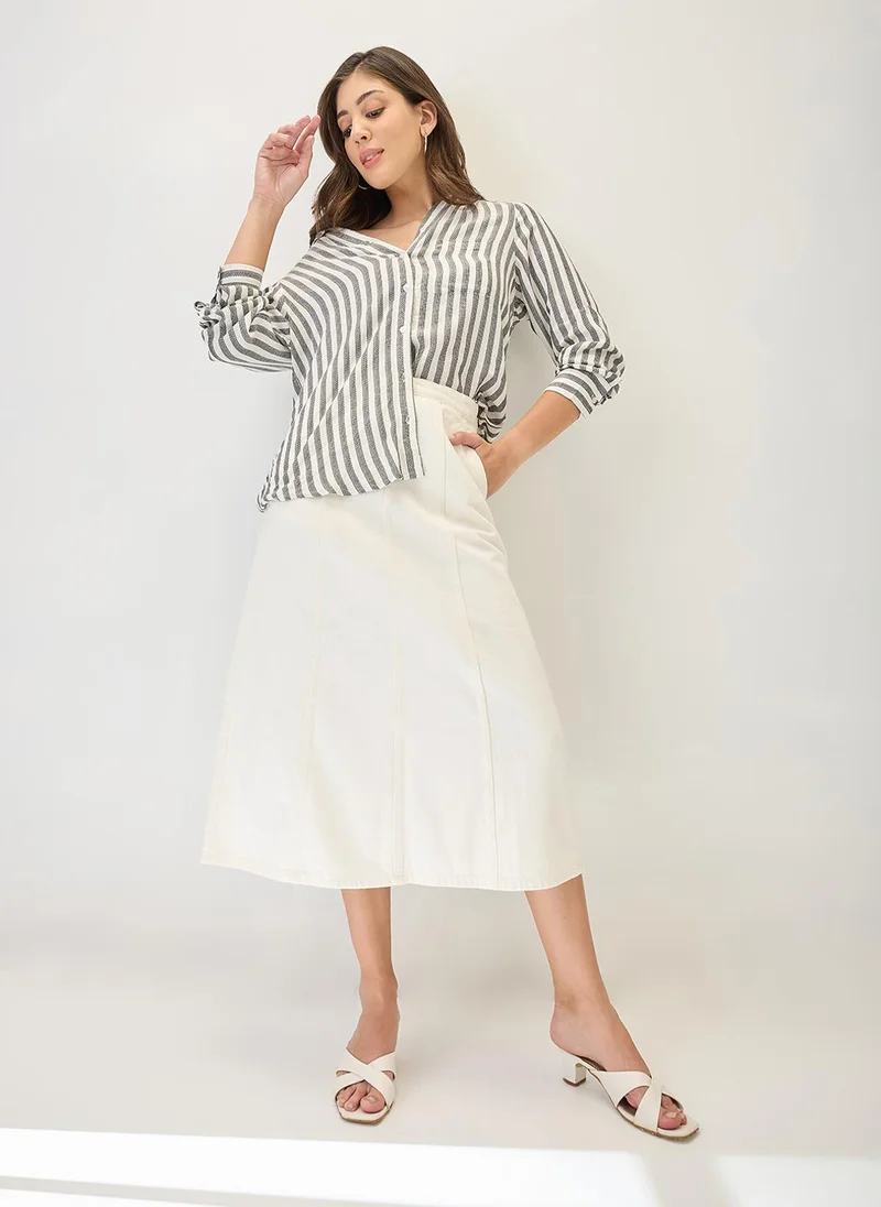 جلو باص تنورة جينز ميدي نسائية بخصر متوسط وقطع جانبية