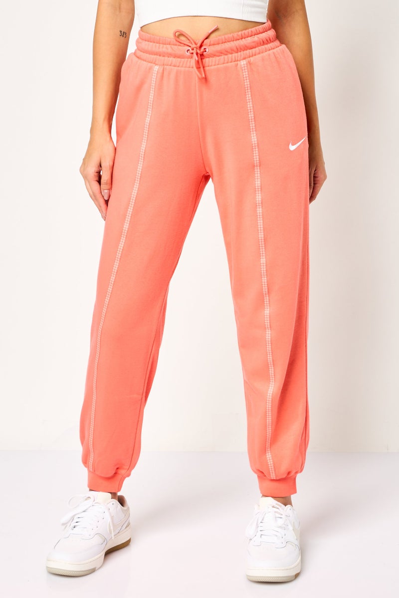 Nike Women Loose Fit Embroidered Logo Outdoor Sweatpants, Dark Peach - Image 1