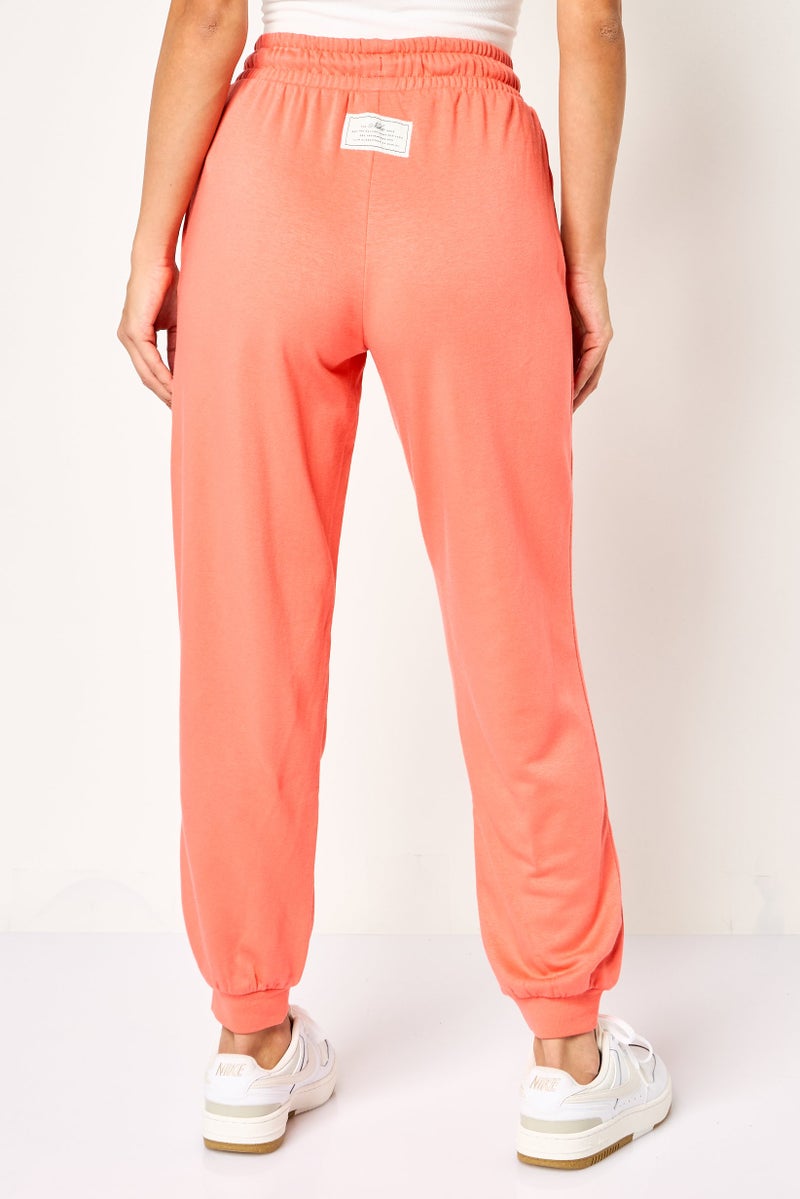 Nike Women Loose Fit Embroidered Logo Outdoor Sweatpants, Dark Peach - Image 4