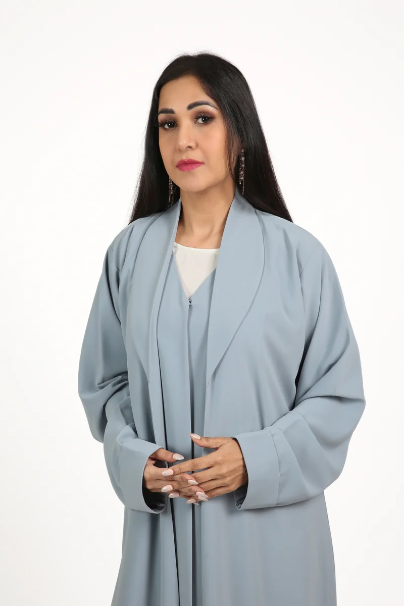 Nikias  Sky blue crepe fabric abaya with nice cuts and unique style for Women | Best Price UAE