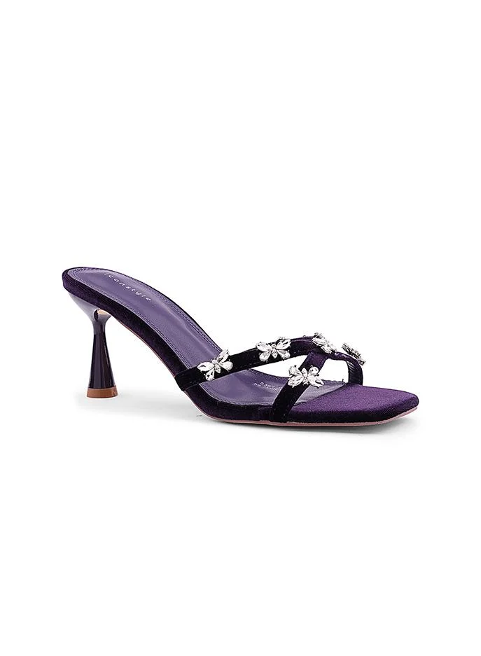أيقون Night Purple Feminine heel slipper featuring decorative bow detail.