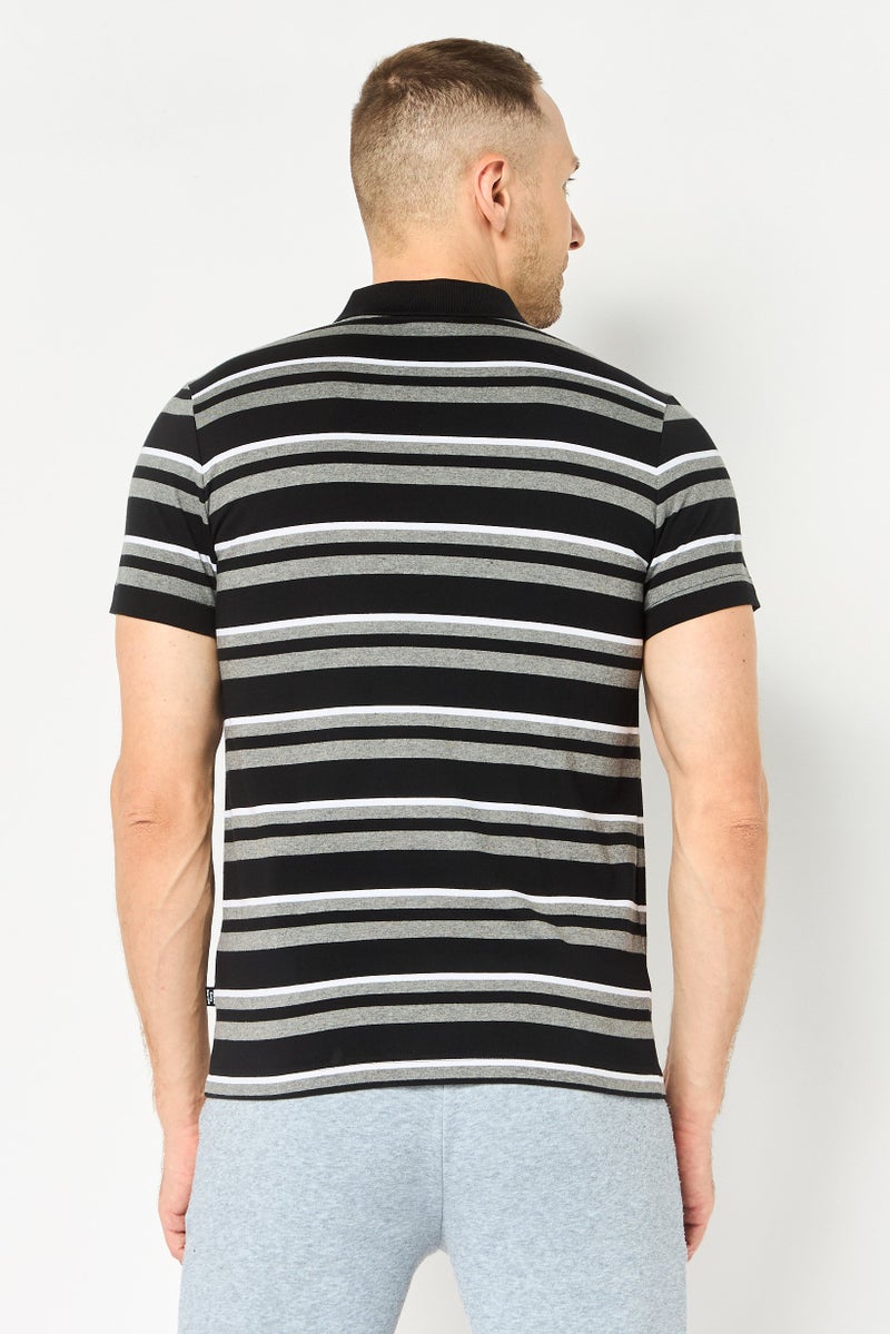 PUMA قميص بولو خارجي أساسي بأكمام قصيرة للرجال بقصة ضيقة، متعدد الألوان - Image 4