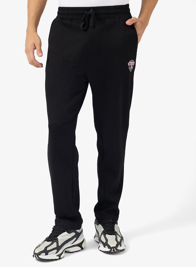 سفنتي فايف بيسيكس بنطلون رياضي مريح بشعار - Image 1