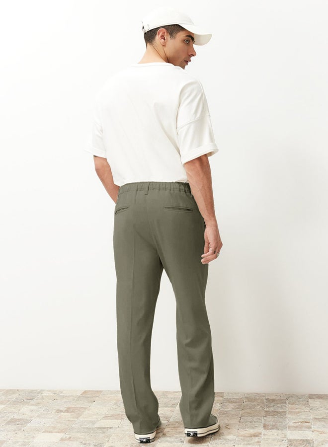 trendyol بنطلون قماش كلاسيكي فضفاض بليسيه باللون الكاكي - Image 5