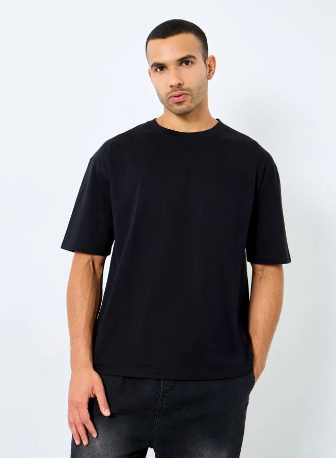 Styli Styli Men Black Text Printed Oversized Jersey T-Shirt