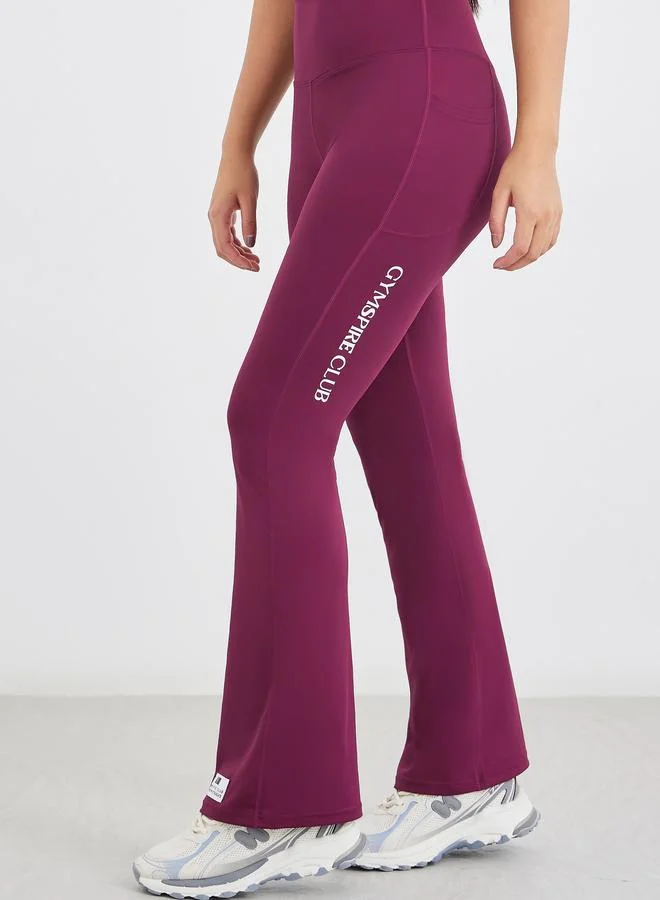 ستايلي Styli Gymspire Edition - Label Broad Waist Side Pocket Flared Leggings with Text Detail