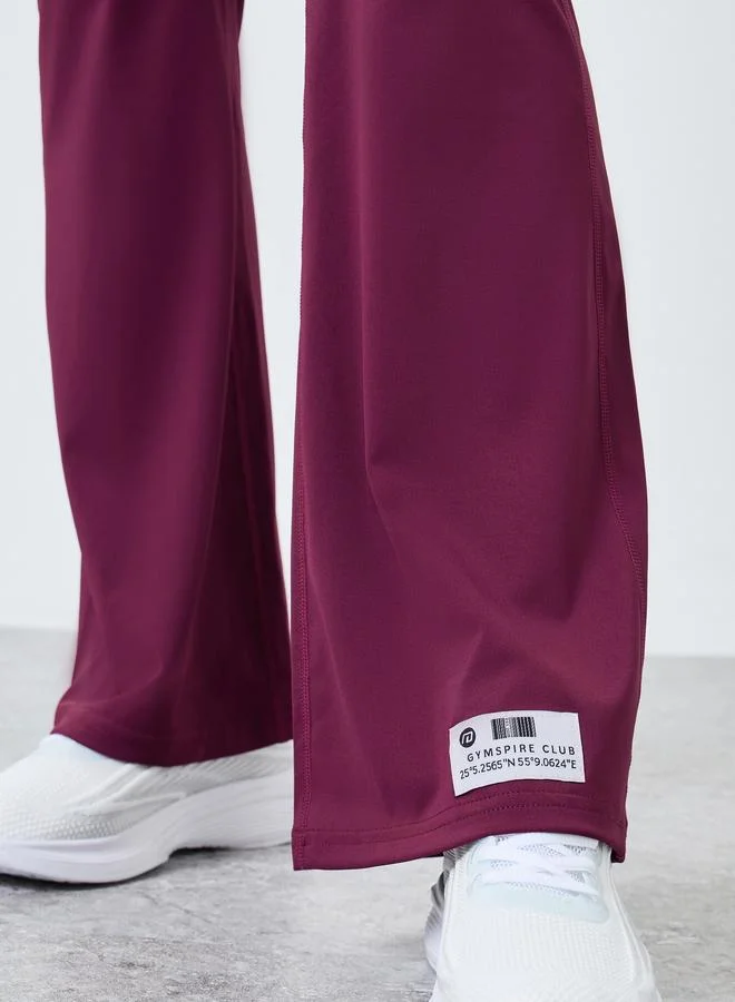 Styli Active purple Gymspire Edition - Label Broad Waist Side Pocket Flared Leggings with Text Detail for Women | Best Price UAE