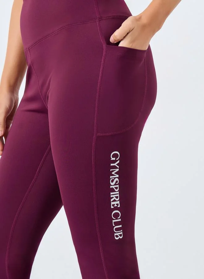 Styli Active purple Gymspire Edition - Label Broad Waist Side Pocket Flared Leggings with Text Detail for Women | Best Price UAE