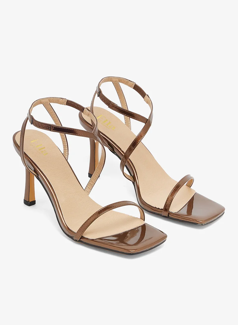 Ella Limited Edition Bronze sandal with asymmetric straps and mid heel