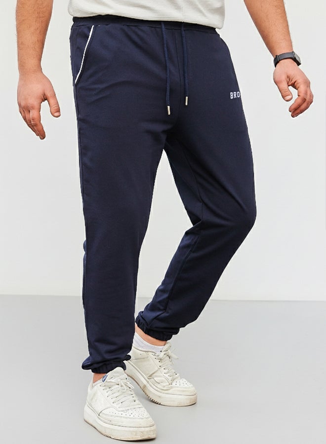 trendyol Navy Blue Regular Fit Printed Elastic Leg Sweatpants TMNSS22EA0121 - Image 2