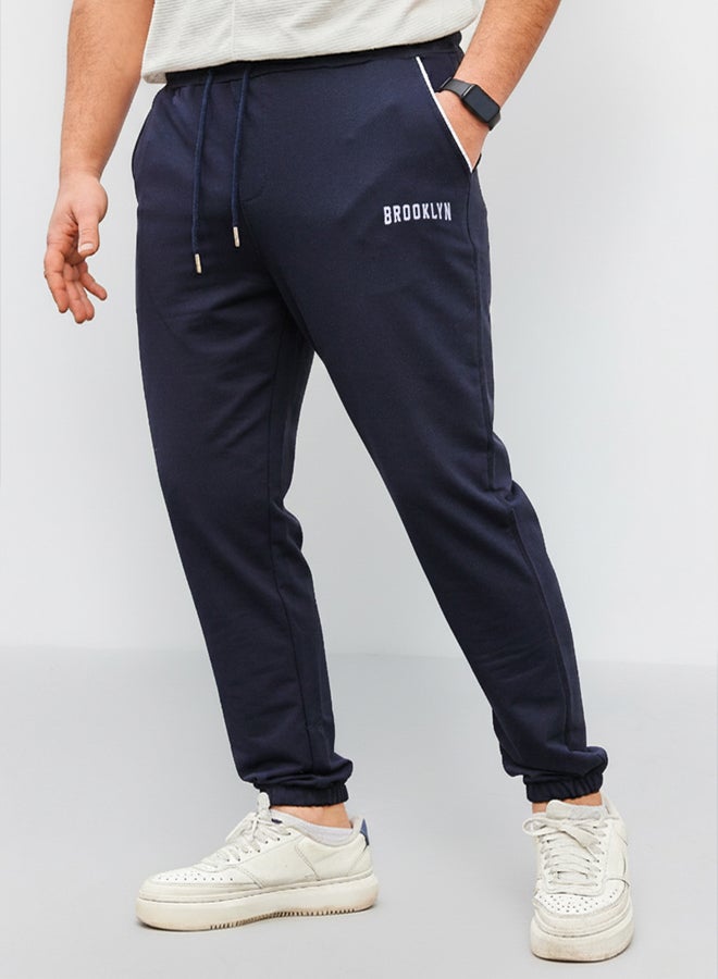 trendyol Navy Blue Regular Fit Printed Elastic Leg Sweatpants TMNSS22EA0121 - Image 1