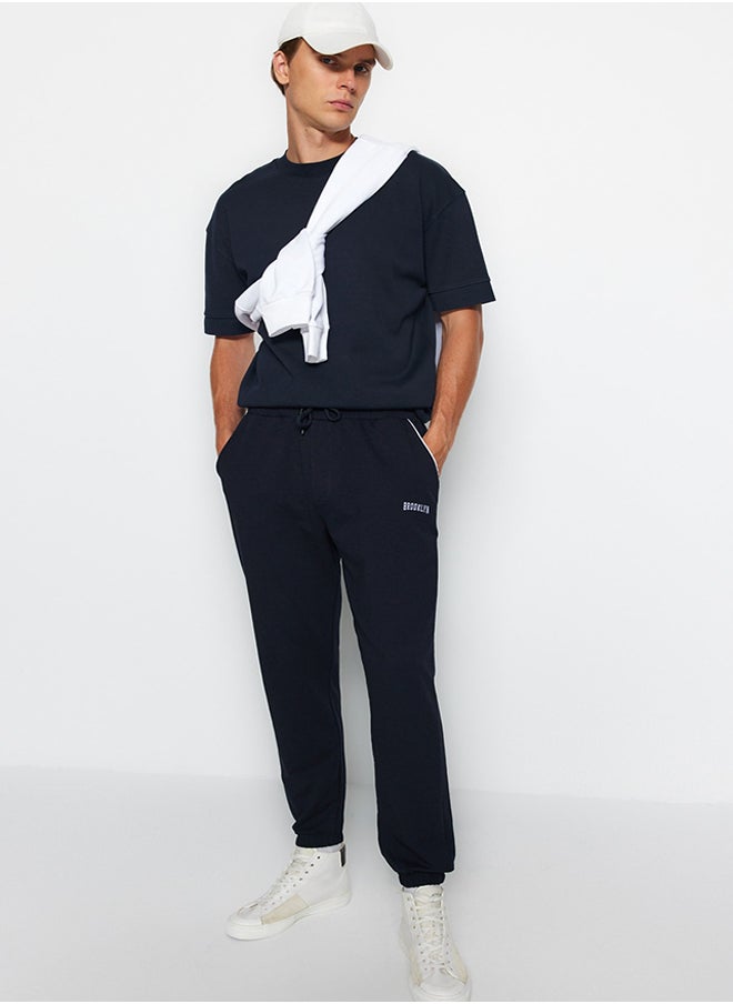 trendyol Navy Blue Regular Fit Printed Elastic Leg Sweatpants TMNSS22EA0121  - Image 1