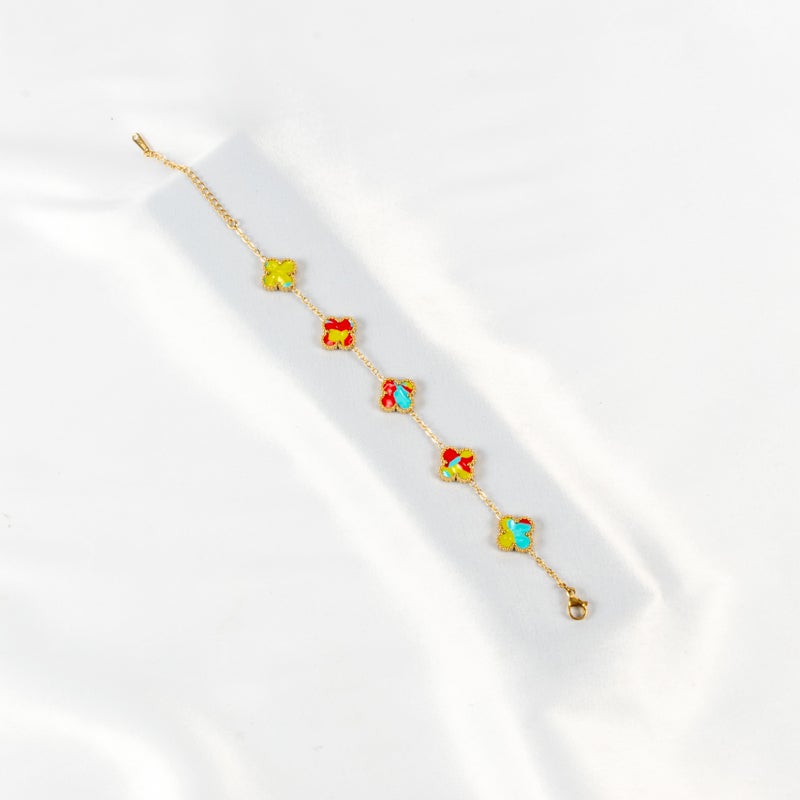 ذا بلاك بيرل اكسسوريز أنسيال أستانليس ستيل ذهبي مع شكل زهرة البرسيم بألوان خلابة - Image 1