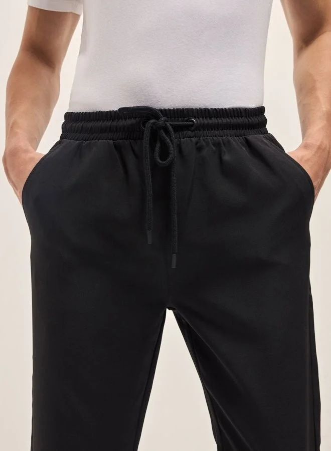 THE BEAR HOUSE  Men's Black Classic Korean-Inspired Elastic Waist Casual Trouser Versatile Office and Travel Pants Comfortable Fit for Everyday Use Easy to Style Bottomwear for Work Weekend and Outings for Men | Best Price UAE