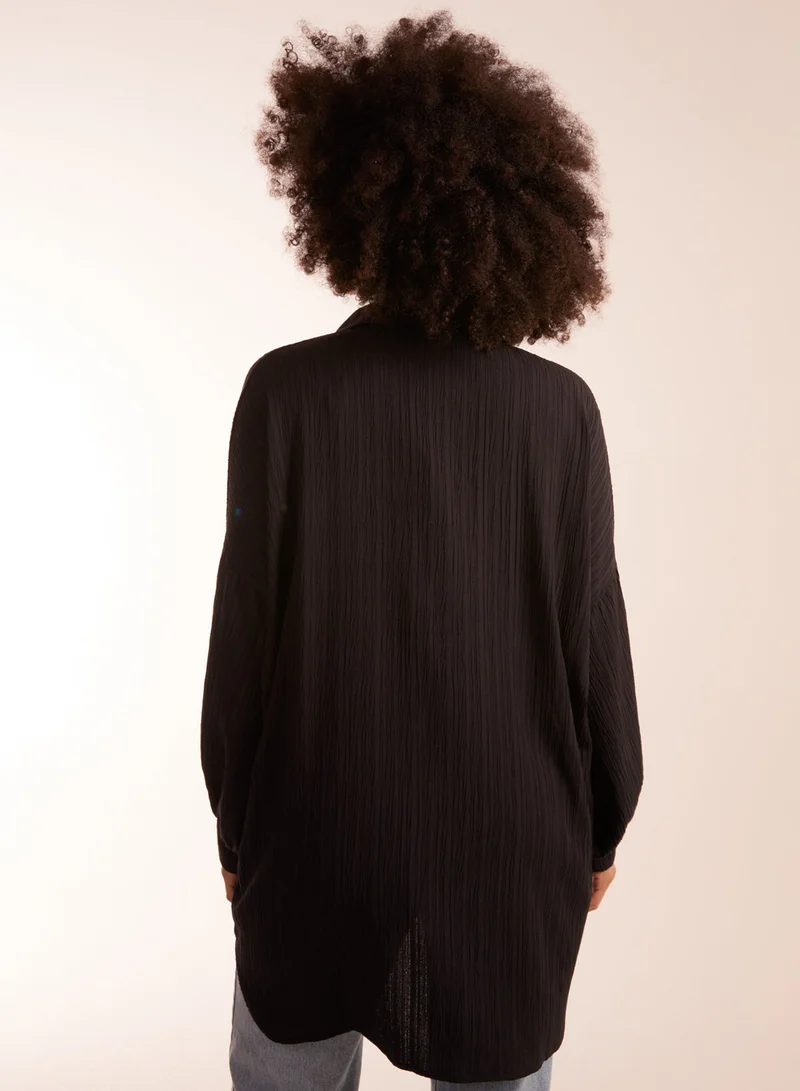 بلو فانيلا قميص فضفاض مجعد