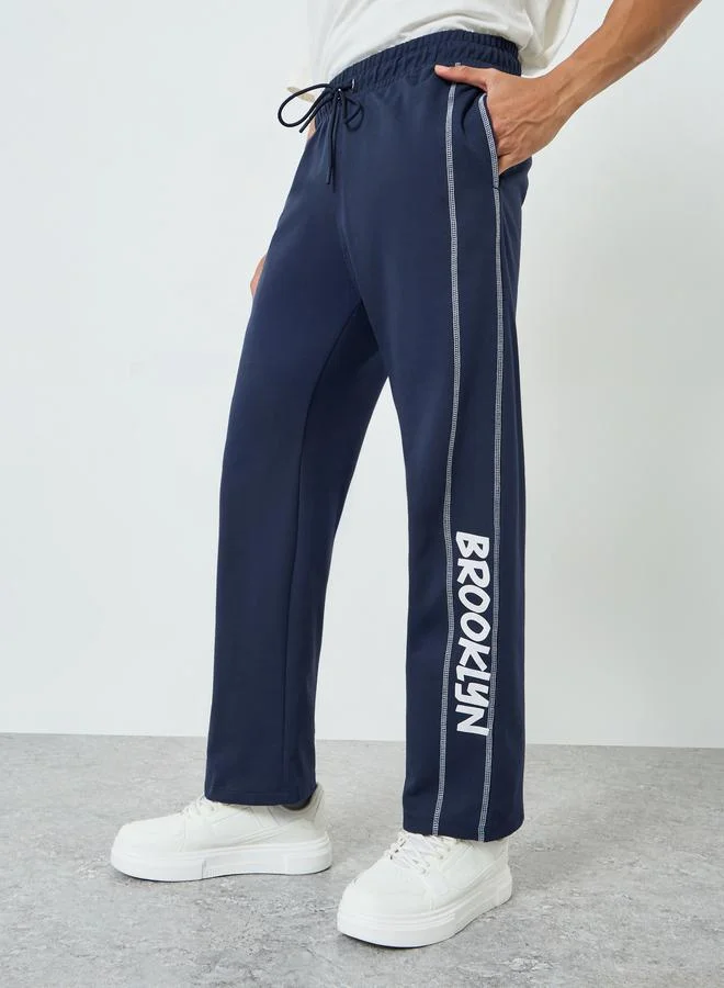 Men Navy Blue Oversized Side Panel Print Joggers