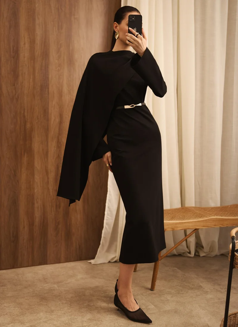 Maxi dress with asymmetrical cape and matching belt