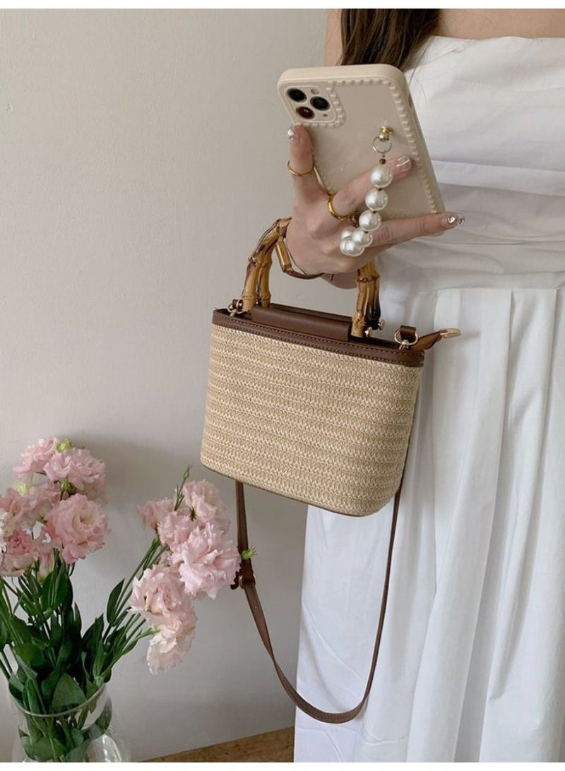 Women's Woven Straw Bucket Crossbody Bag with Bamboo Handle and Zipper Closure - Image 1