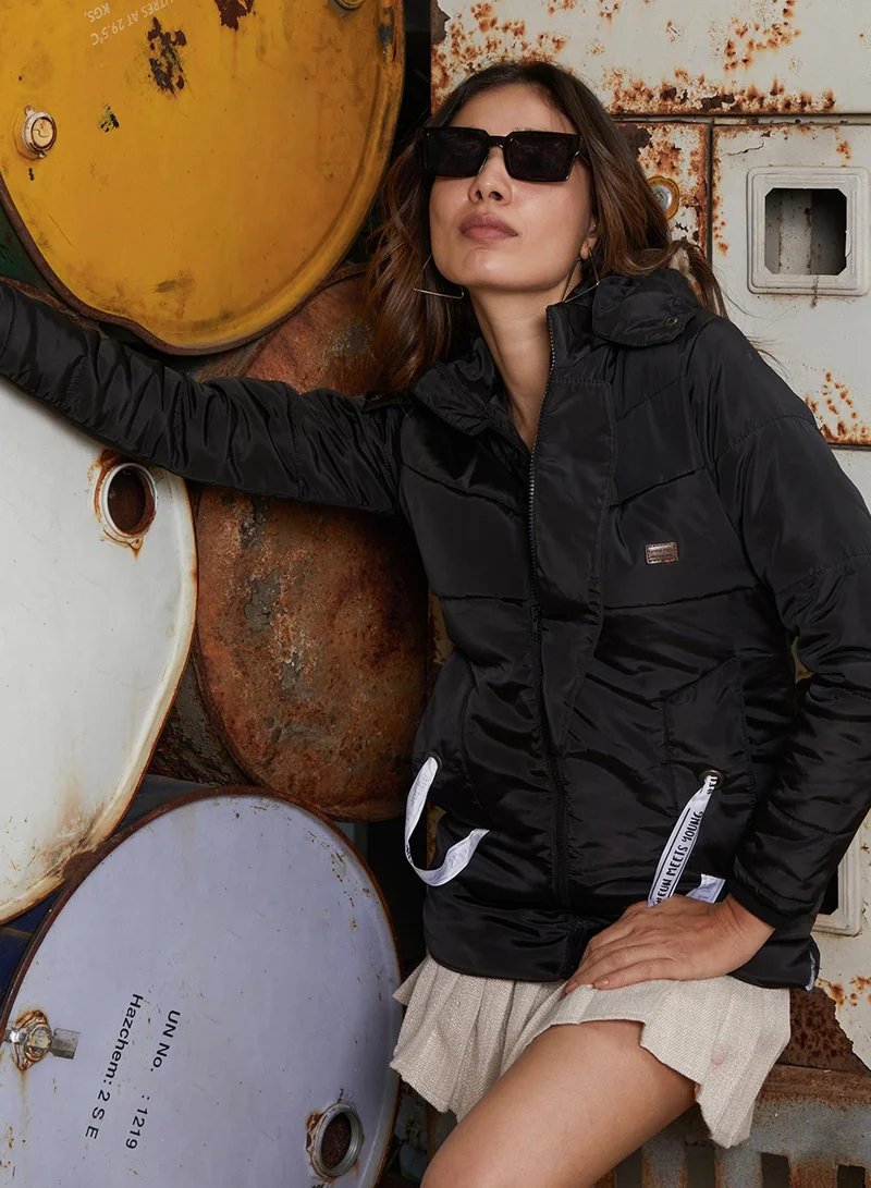 Campus Sutra Women's Onyx Black Zip-Front Trek Puffer Jacket For Casual Wear | Hooded Neck | Long Cuffed Sleeves | Zipper Closure | Jacket Crafted With Comfort Fit For Everyday Wear