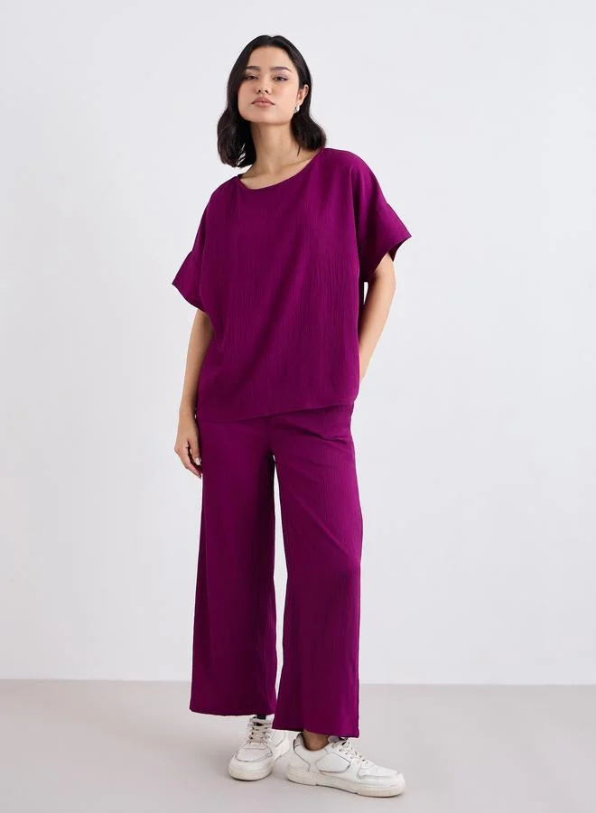 Styli Styli Textured Round Neck Top and Flared Pants Co-Ords