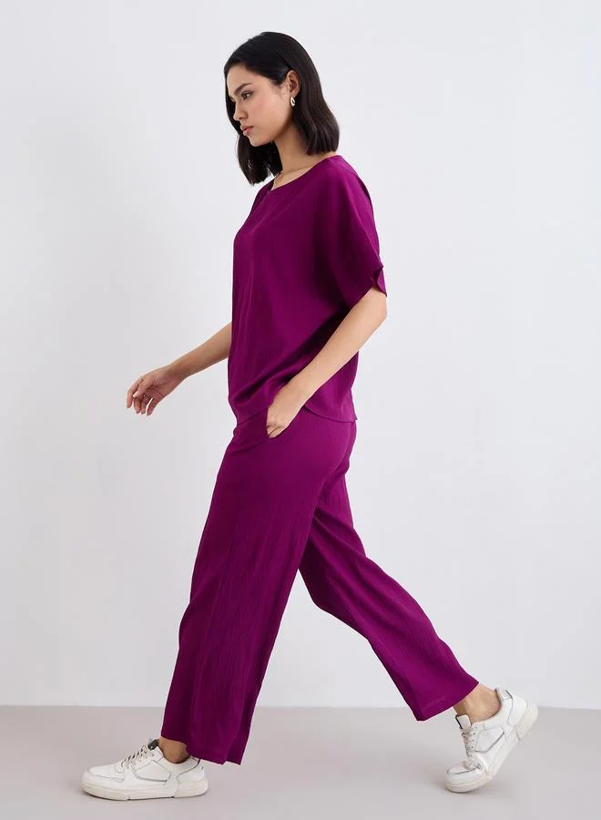Styli Styli Textured Round Neck Top and Flared Pants Co-Ords
