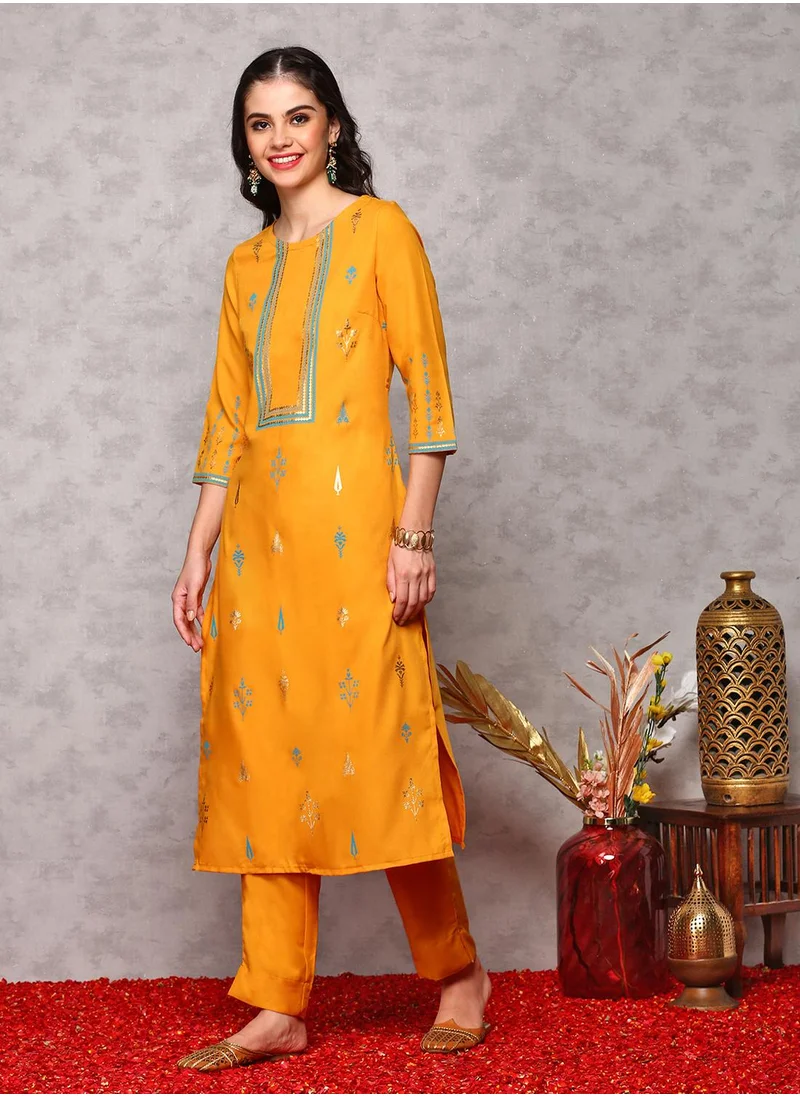 آي شين Straight Fit Printed Pattern Round Neck Three-Quarter Sleeves Mustard Colour Woven Cotton Kurta Set for Women with Semi Elastic Closure - Blending Tradition with Modern Style