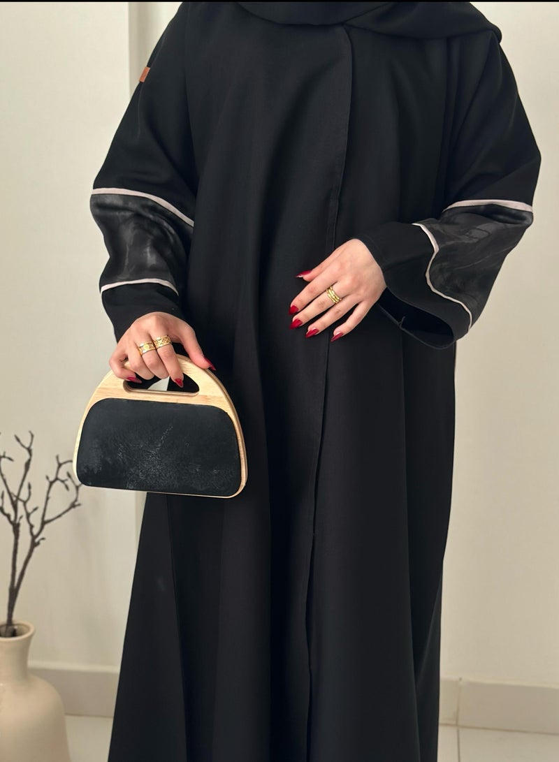 A handbag with a distinctive design with a wooden frame - Image 2