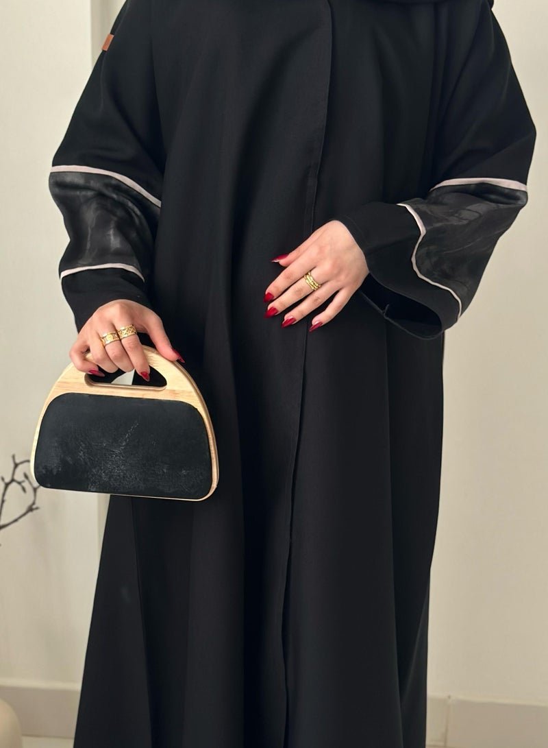 A handbag with a distinctive design with a wooden frame - Image 3
