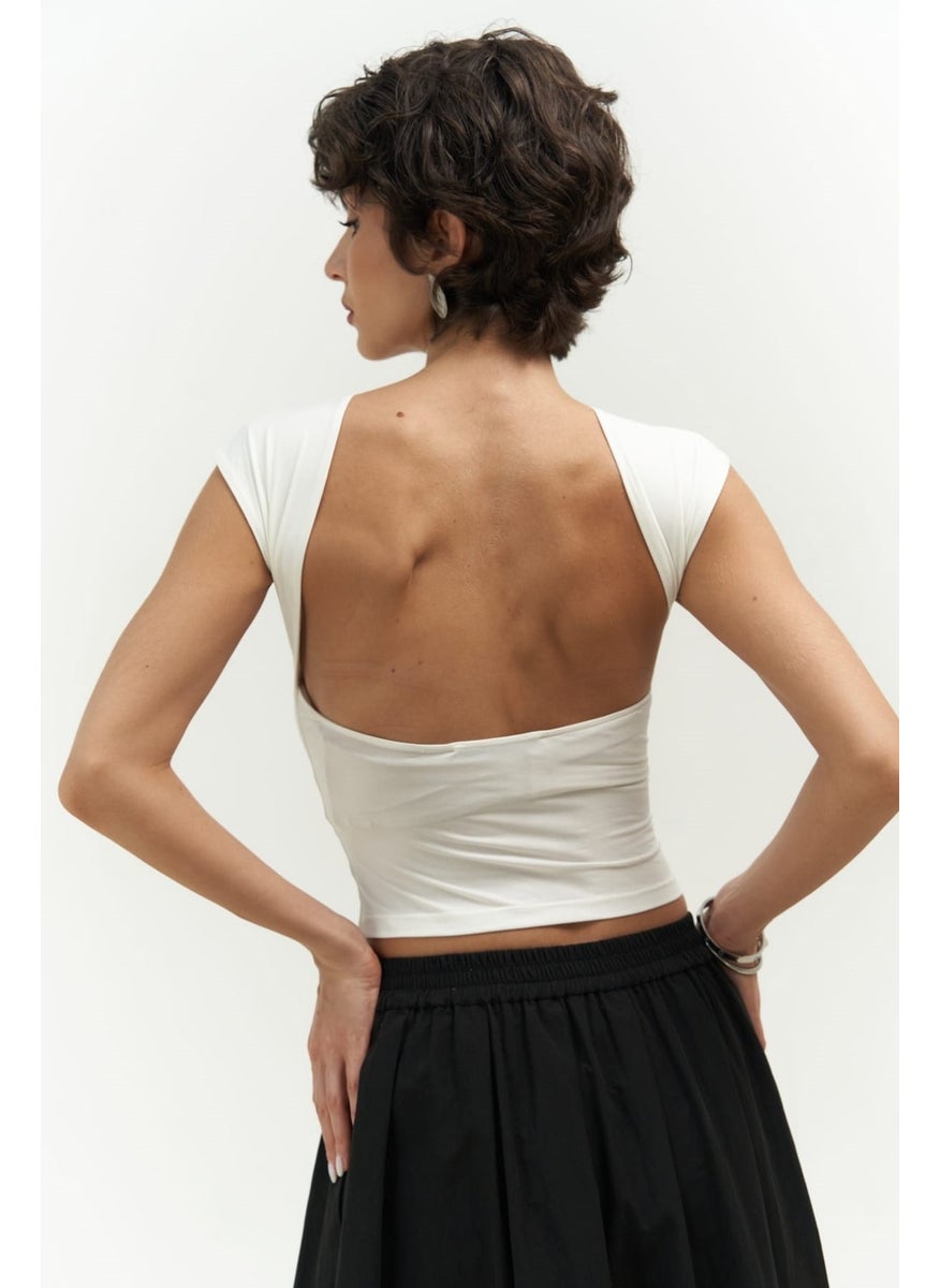 Collection Nives Backless White Crop - pzsku/ZE7A120466CA23C3EAF9CZ/45/_/1741093465/ef128746-3617-4c39-883e-a065d2fea7ae