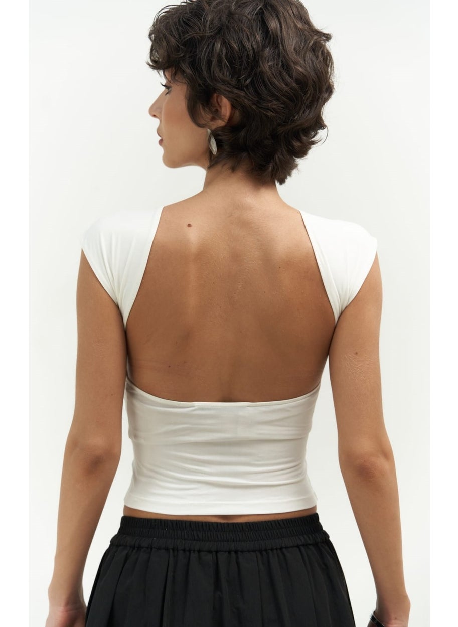 Collection Nives Backless White Crop - pzsku/ZE7A120466CA23C3EAF9CZ/45/_/1741093539/e89a9a6c-1fb5-4ac2-90fd-c51217223465