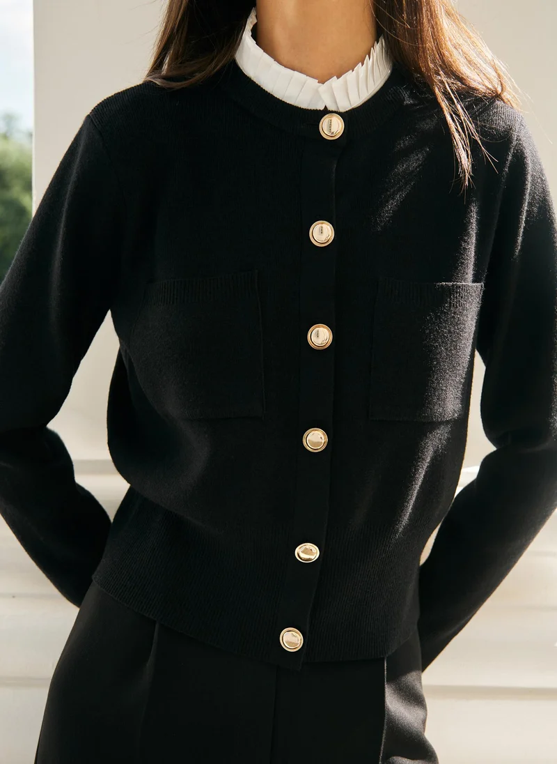 Cardigan with pleated insert on the collar