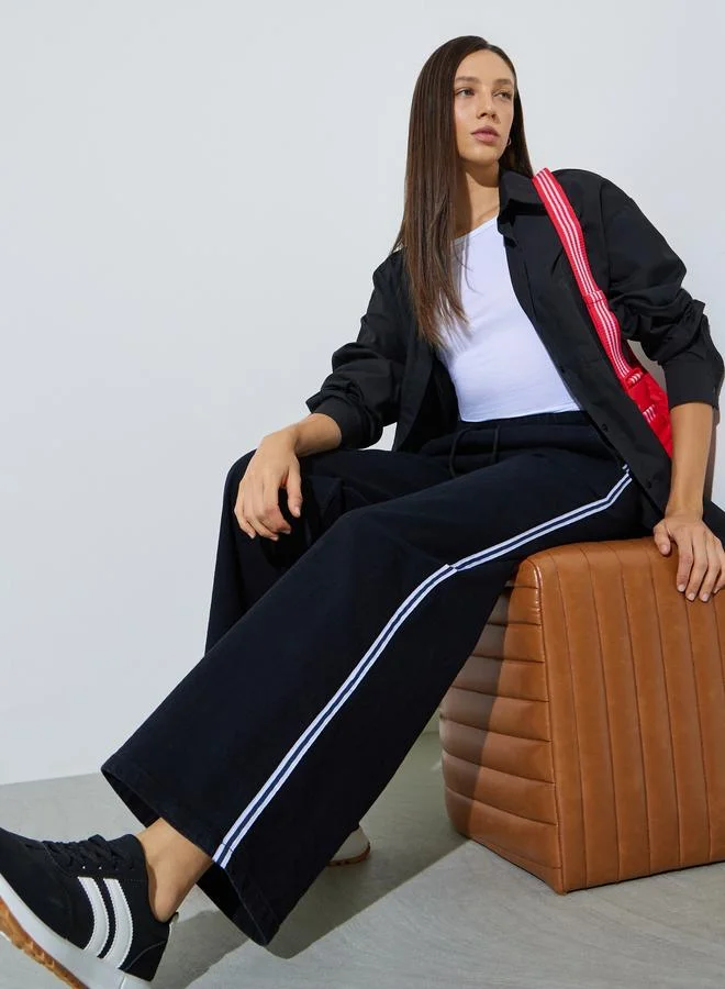 ستايلي Black Wide Leg Denim Jogger With Side Taping Detail