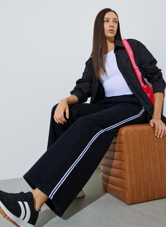 Styli Black Wide Leg Denim Jogger with Side Taping Detail - Image 1