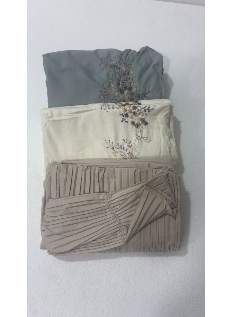 A set of 3 prayer garments made of soft, ultra-comfortable cotton—comprising two embroidered pieces and one pleated piece. Each includes an attached headscarf and offers full-body coverage in a spacious, one-size-fits-all design suitable for all body types.