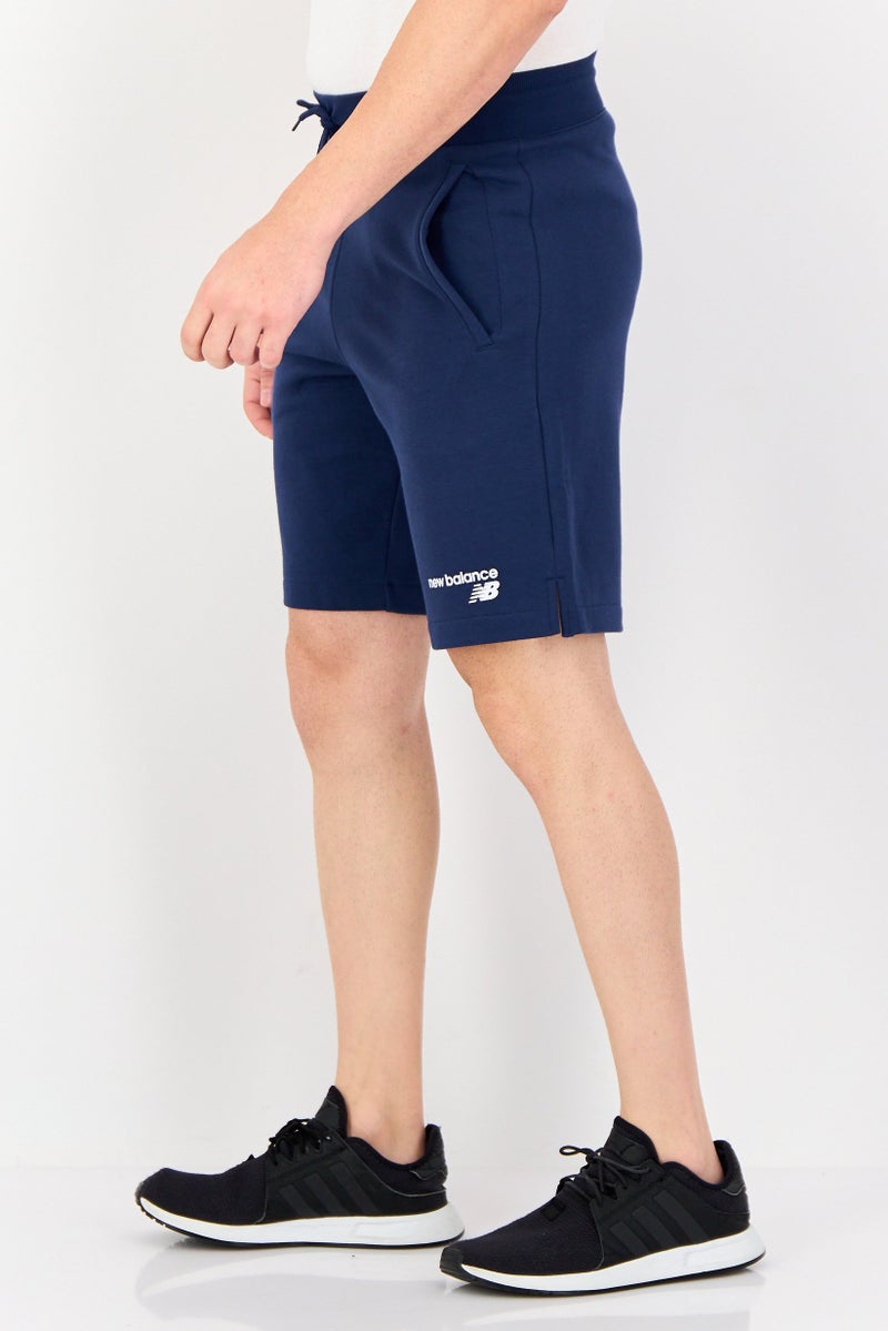 New Balance شورتات جري للرجال بتصميم رياضي مع شعار العلامة التجارية، أزرق داكن - Image 3