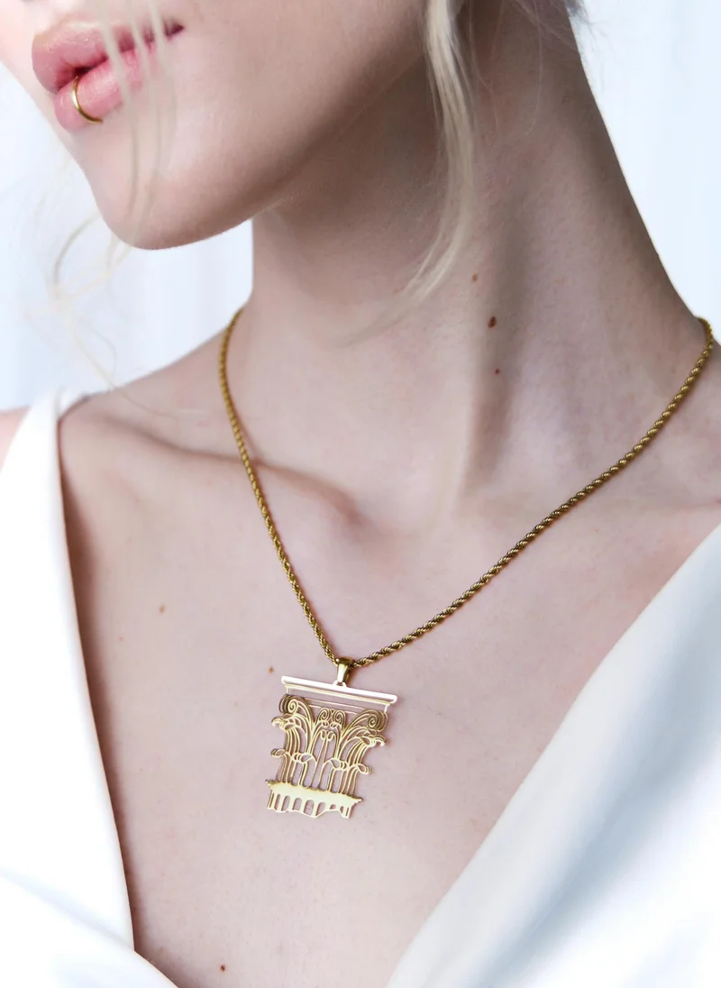 Golden necklace with antique pendant