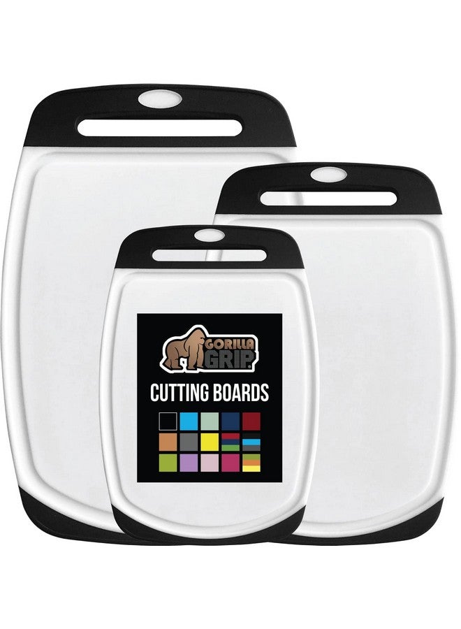 GORILLA GRIP 100% BPA-Free Reversible Kitchen Cutting Board Set of 3, Nonporous, Juice Grooves to Catch Liquid, Slip Resistant Handle Border, Dishwasher Safe, Durable Large Food Chopping Boards, Black - Image 1