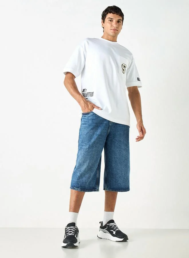 ستارتر تيشيرت بياقة ضيقة وأكمام قصيرة وطبعات تايبوجرافيك من ستارتر