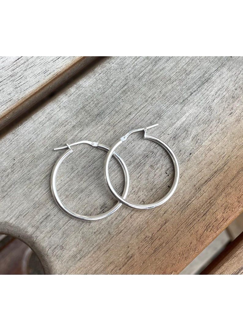 Luxuria Women's silver hoop earrings in classic colors, designed in a soft and simple style and in a medium to large size, are very suitable for both casual and formal everyday looks. - Image 2