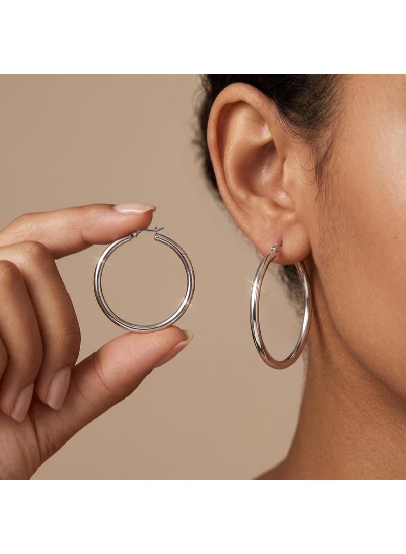 Luxuria Women's silver hoop earrings in classic colors, designed in a soft and simple style and in a medium to large size, are very suitable for both casual and formal everyday looks. - Image 1