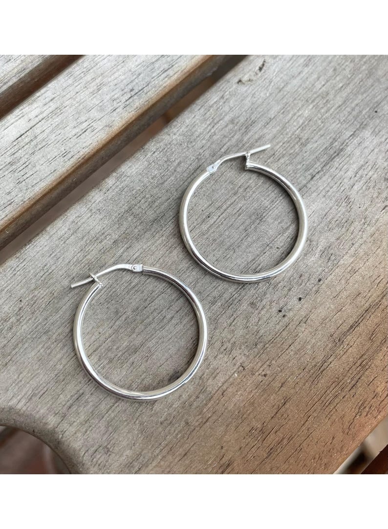 Luxuria Women's silver hoop earrings in classic colors, designed in a soft and simple style and in a medium to large size, are very suitable for both casual and formal everyday looks. - Image 3