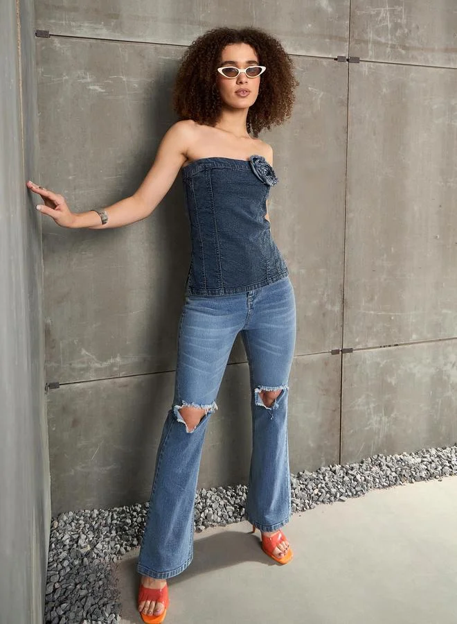 ساسافراس جينز أزرق بقصة جرس وفتحة عند الركبة