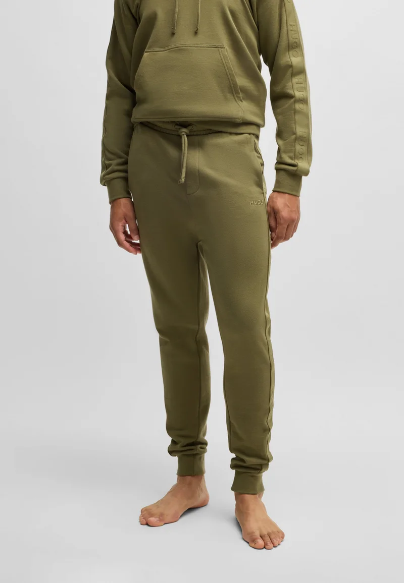 HUGO Cotton-terry tracksuit bottoms with logo tape