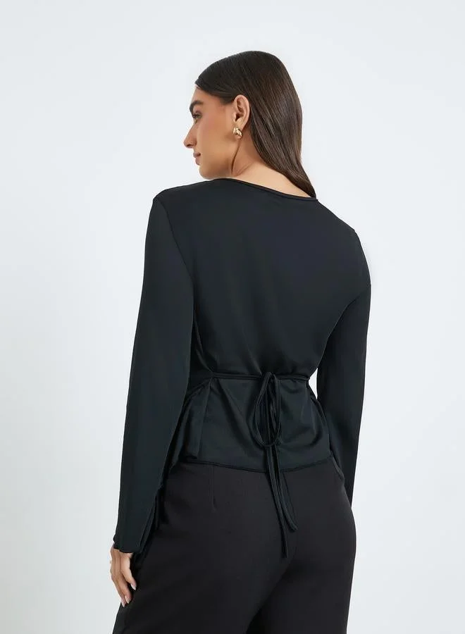 Styli  Women Black Asymmetric Hem Knit Top for Women | Best Price UAE