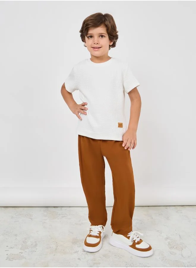 ستايلي Styli Patch Detail Textured T-shirt and Relaxed Fit Pant Set