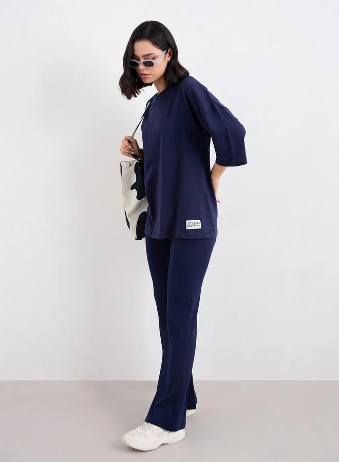 ستايلي Styli Patch Detail Oversized T-Shirt and Flared Leggings Co-Ords