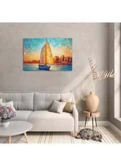 Sailboat on the water in front of an orange and blue sky with clouds