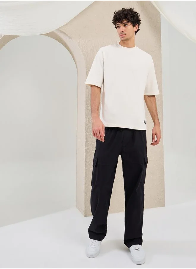 Styli Solid Badge Detail Oversized T-Shirt