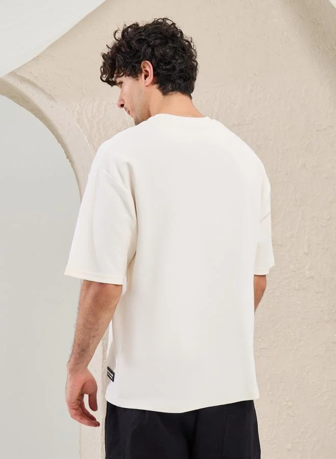 Styli Styli Solid Badge Detail Oversized T-Shirt